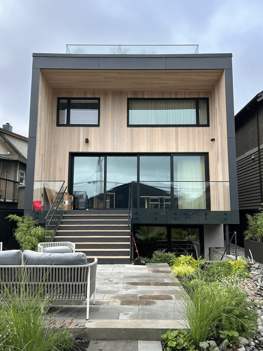 Cube, modern house with wood panel exterior.